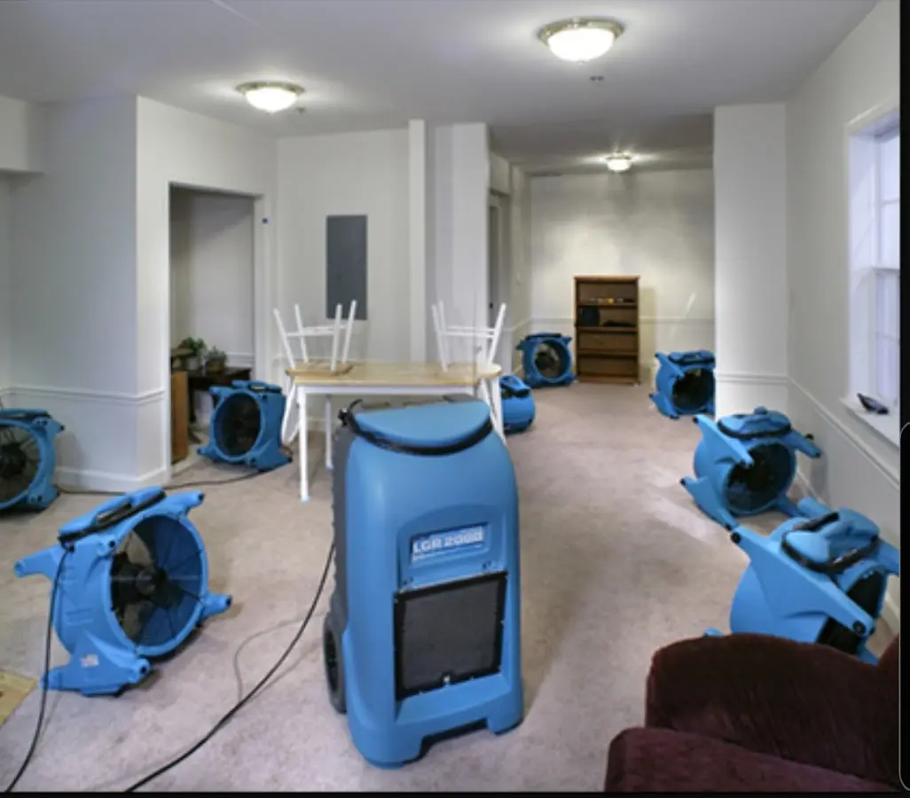 Air movers and dehumidifier setup for Water Damage Restoration in Fairport
